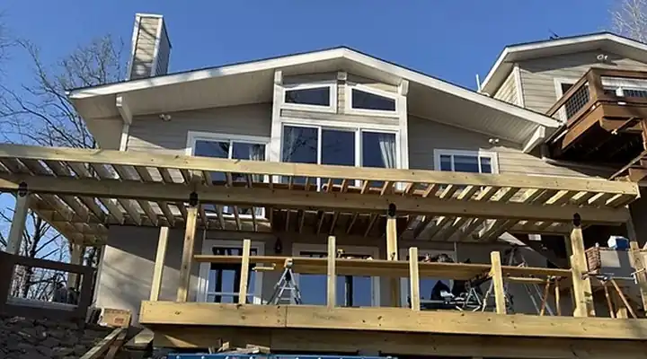 Three-tier deck under construction on a lake house