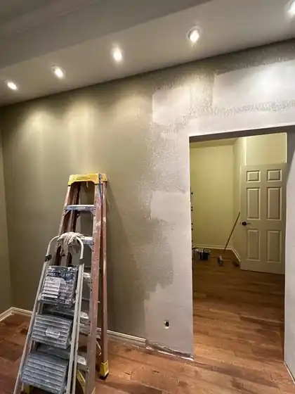 Interior wall being finished with recessed lights